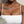 Load image into Gallery viewer, Person wearing a white top with visible tattoos and a necklace.