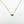 Load image into Gallery viewer, Gold necklace with a green gemstone pendant on a white background