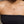 Load image into Gallery viewer, Person wearing a gold necklace with a small pendant on a neutral background
