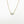 Load image into Gallery viewer, Gold necklace with a rectangular pendant on a white background
