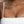 Load image into Gallery viewer, Person with tattoos and a necklace, wearing a white garment.
