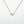 Load image into Gallery viewer, Gold necklace with a rectangular pendant on a white background
